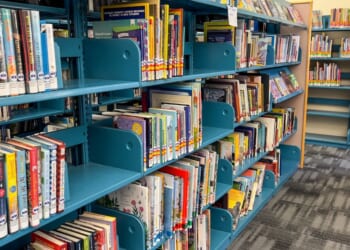 A public school library inside of a school.