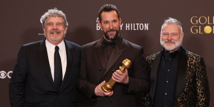 Producer John Wells, actor Noah Wyle, and producer R. Scott Gemmill, winners of the Best Television Series - Drama Award for "The Pitt", pose in the press room during the 83rd annual Golden Globe Awards at the Beverly Hilton hotel in Beverly Hills, California, on Jan. 11, 2026.