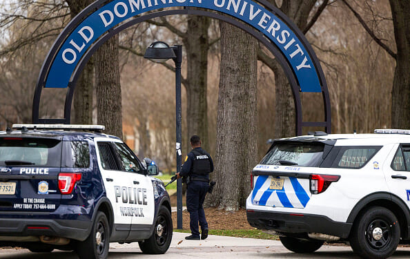 Police gather outside the Old Dominion University campus on March 12, 2026. (Kendall Warner - The Virginia Pilot / Getty Images)