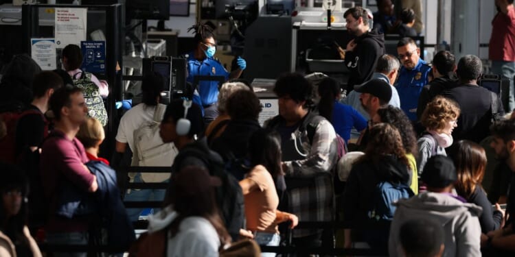 Passengers wait in line for a Transportation Security Administration security checkpoint at Los Angeles International Airport in Los Angeles on Nov. 26, 2025.