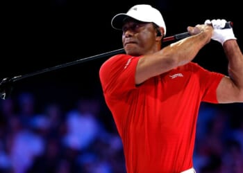 Tiger Woods plays a shot on the ninth hole at SoFi Center on Tuesday in Palm Beach Gardens, Florida. Woods was reportedly involved in a rollover car accident Friday on Jupiter Island, Florida.