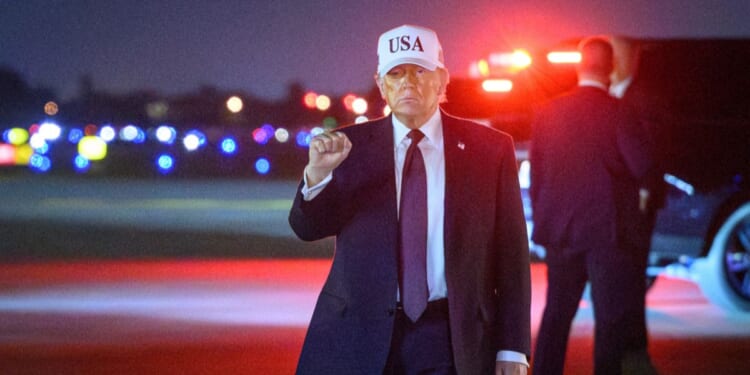 President Donald Trump pumps his fist at Palm Beach International Airport in West Palm Beach, Florida, on Feb. 27, 2026.
