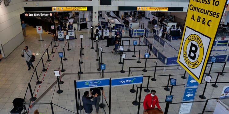 Travelers pass quickly though security lines Monday at BWI Airport in Baltimore, Maryland. Airports around the country started recovering from long lines as TSA agents begin to receive their first paychecks after President Donald Trump issued an order for them to be paid. About 61,000 TSA employees had been working without pay since a partial government shutdown started February 14.