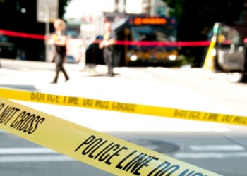 Investigators said the woman was found at the bus stop with 30 stab wounds.