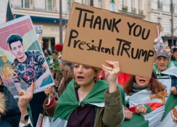 Protesters supporting opposition leader Reza Pahlavi celebrate the death of Ayatollah Khamenei, Supreme Leader of the Islamic Republic of Iran, in Paris Sunday. Around the globe, Iranians turned out to show support for the joint U.S.-Israeli action against Iran, but at least some U.S. media evidently wanted to downplay anything that showed approval of President Donald Trump,