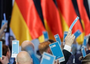 Delegates hold a voting card at the AfD Saxony-Anhalt state party congress on April 11, 2026, in Magdeburg, Germany.