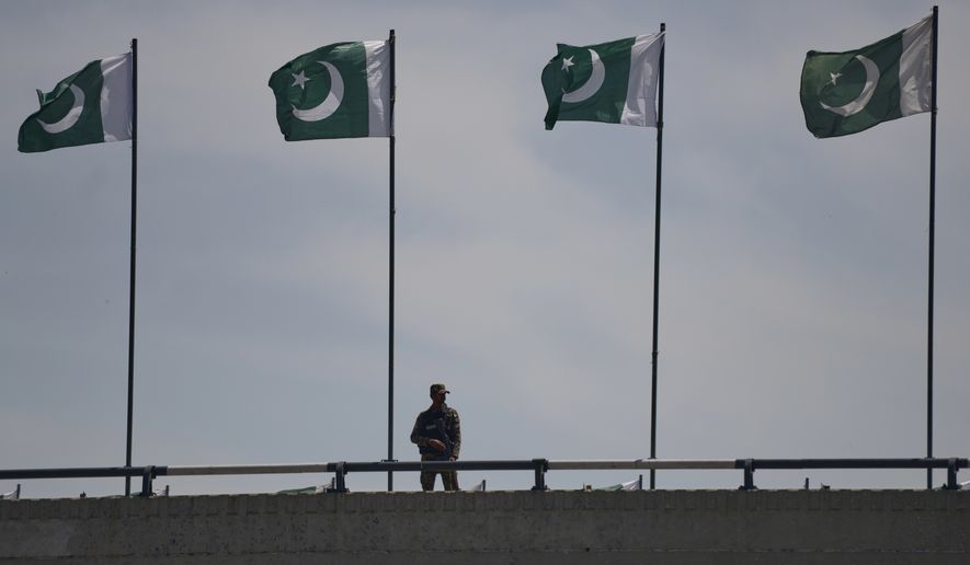 A soldier stands guard on a bridge ahead of second round of negotiations between the U.S. and Iran, in Islamabad, Pakistan, Monday, April 20, 2026. (AP Photo/M.A. Sheikh)