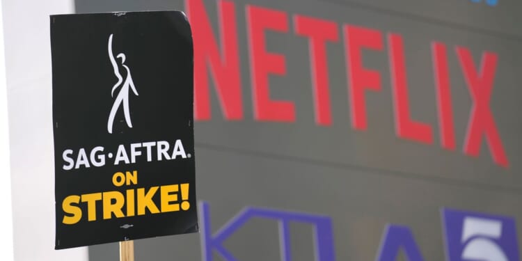 Screenwriters overwhelmingly approve a 4-year contract with Hollywood studios