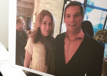 A picture showing Lonna Drewes and former Rep. Eric Swalwell, a Democrat from California, is shown during a press conference where she described her claims about sexual misconduct by Swalwell in Beverly Hills, California, on April 14, 2026.