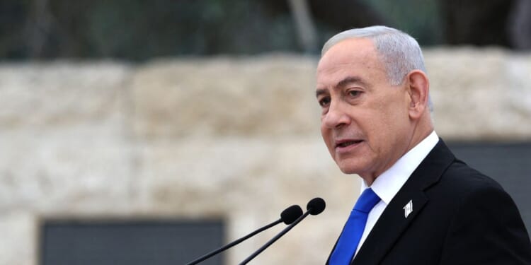 Israeli Prime Minister Benjamin Netanyahu speaks during a ceremony commemorating Israel's Remembrance Day for fallen soldiers, or Yom HaZikaron, at the Military Cemetery on Mount Herzl in Jerusalem on April 21, 2026.