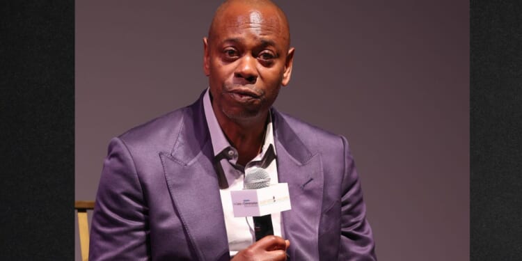 Comedian Dave Chappelle, seen in an August photo, refuses to feel guilty for his jokes.