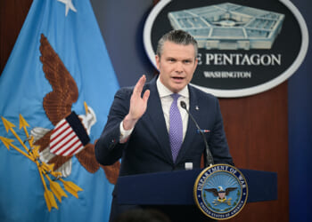 Secretary of War Pete Hegseth speaks at press room podium at the Pentagon on March 31, 2026.