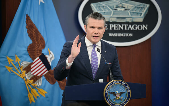 Secretary of War Pete Hegseth speaks at press room podium at the Pentagon on March 31, 2026.