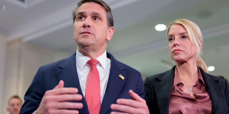 Deputy Attorney General Todd Blanche speaks beside Attorney General Pam Bondi on March 18, 2026.