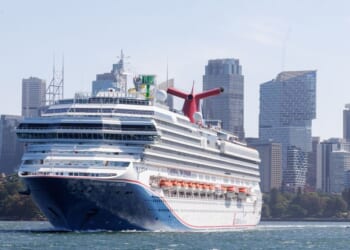 Large Carnival Splendor cruise ship sailing in Sydney Harbor with the skyline in the background in Sydney in the state of New South Wales in southeastern Australia on Feb. 13, 2025.