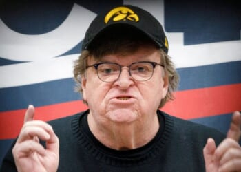 Trump-hating filmmaker and director Michael Moore, seen stumping for then-presidential candidate Bernie Sanders in 2020, railed against the U.S. in a blog post this week, calling Americans the "bad guys."