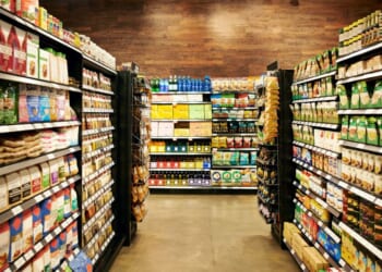 A fully stocked grocery store during the day.