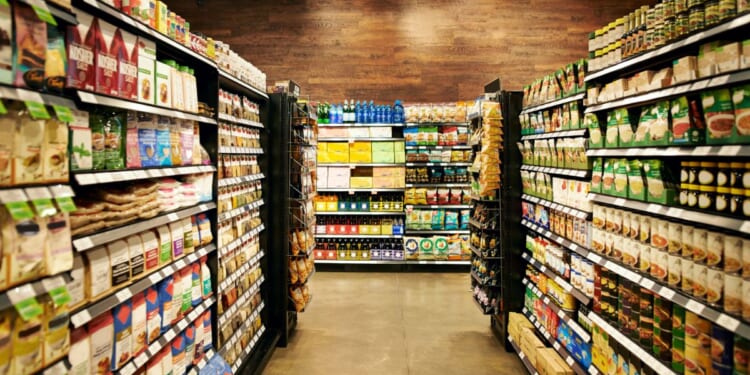 A fully stocked grocery store during the day.