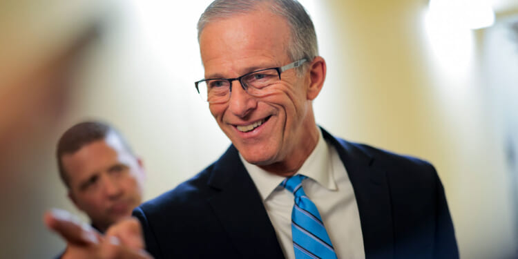 Senate Majority Leader John Thune speaks to reporters in the Capitol.