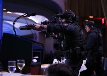 Agents stand guard with their rifles after a shooting reportedly took place at the White House Correspondents Dinner in Washington, DC on April 25, 2026.
