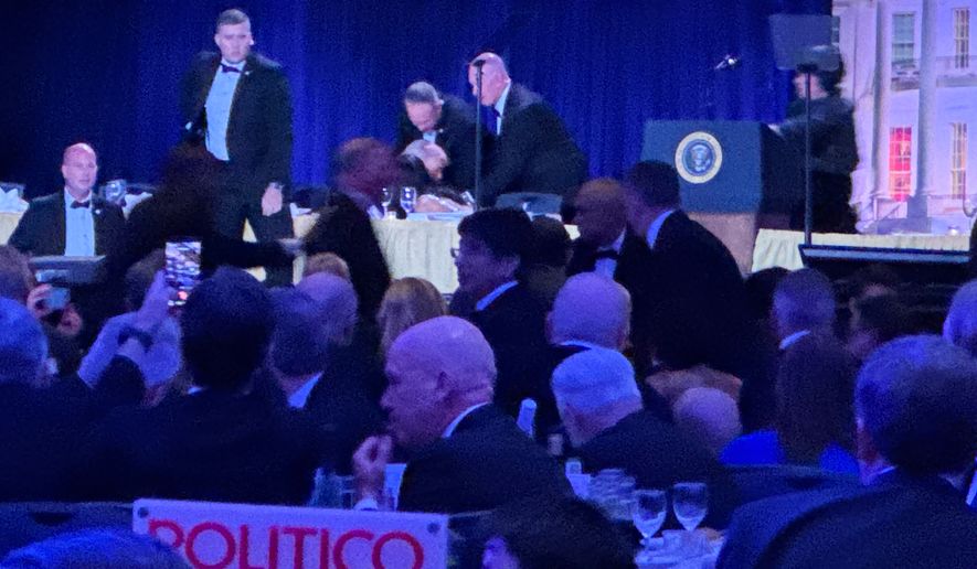 Secret service agents respond during the White House Correspondents Dinner, Saturday, April 25, 2026, in Washington. (AP Photo/Mark Schiefelbein)
