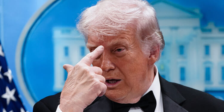 President Donald Trump in a tuxedo discusses leftist political violence