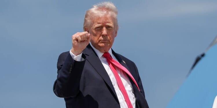President Donald Trump gestures as he boards Air Force One on April 16, 2026, at Joint Base Andrews, Maryland.