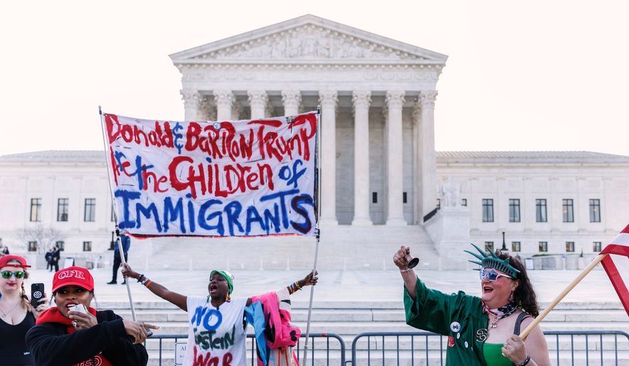 Demonstrators holding opposing views verbally engage ahead of President Donald Trump's arrival at the U.S. Supreme Court, Wednesday, April 1, 2026, in Washington. (AP Photo/Tom Brenner)