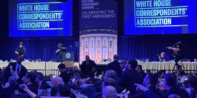 Members of the U.S. Secret Service counter assault team cover the stage of the White House Correspondents' dinner after a shooting took place in Washington, DC on April 25, 2026.