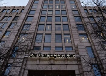 The Washington Post Headquarters stands flanked by bare black trees on January 27, 2026.