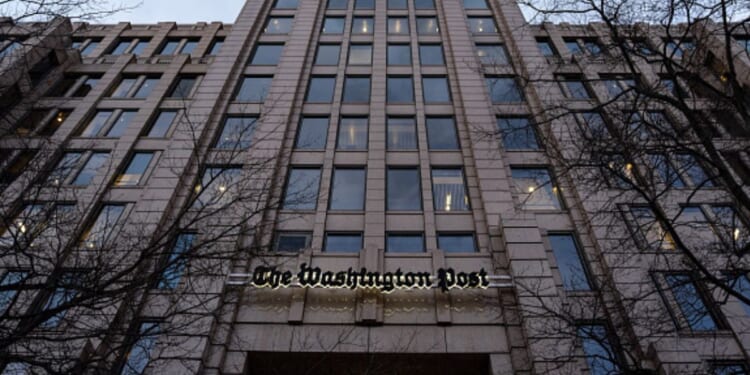 The Washington Post Headquarters stands flanked by bare black trees on January 27, 2026.
