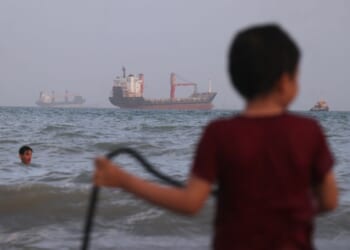 Ship hit by projectiles in Strait of Hormuz, British military says