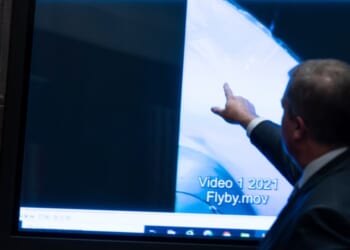 Then Deputy Director of Naval Intelligence Scott Bray points to a video display showing an Unidentified Anomalous Phenomena (UAP) during a hearing of the House Intelligence, Counterterrorism, Counterintelligece, and Counterproliferation Subcommittee hearing on Capitol Hill in Washington on May 17, 2022.