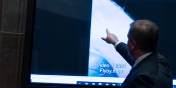 Then Deputy Director of Naval Intelligence Scott Bray points to a video display showing an Unidentified Anomalous Phenomena (UAP) during a hearing of the House Intelligence, Counterterrorism, Counterintelligece, and Counterproliferation Subcommittee hearing on Capitol Hill in Washington on May 17, 2022.