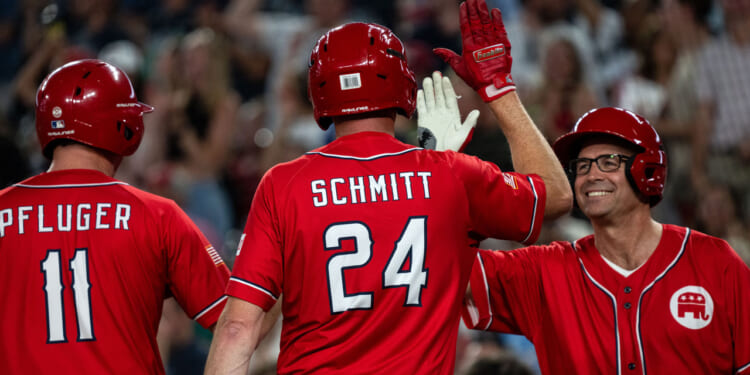 Rep. August Pfluger (R-TX) and Sen. Eric Schmitt (R-MO) celebrate with Rep. Jake Ellzey (R-TX) during the Congressional Baseball Game for Charity at National's Park on June 12, 2024 in Washington, DC.