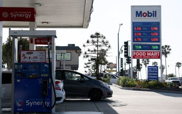 Vehicles park at a Mobil gas station in Redondo Beach, California on April 30, 2026.