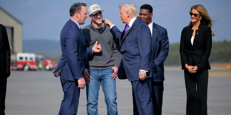 President Donald Trump greeting Burt Jones at Russell Regional Airport on February 19, 2026 in Rome, Georgia.