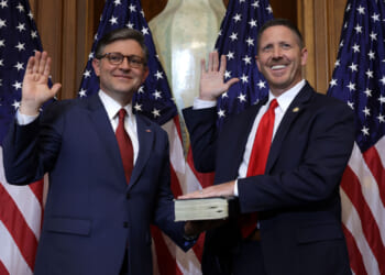 U.S. Speaker of the House Rep. Mike Johnson (R-LA) (L) participates in a ceremonial swearing-in with Rep. Josh Brecheen (R-OK) at the U.S. Capitol on January 3, 2025 in Washington, DC.