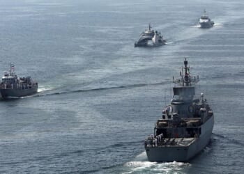 This handout photo made available by the Iranian Army Office on March 12, 2025, shows navy vessels taking part in a joint Iranian-Russian-Chinese military drill in the Gulf of Oman.