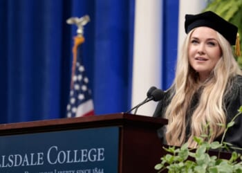 Erika Kirk, Turning Point CEO and widow of founder Charlie Kirk, delivers a commencement address at Hillsdale College during the college's 174th commencement ceremony in Hillsdale, Michigan, on May 9, 2026.