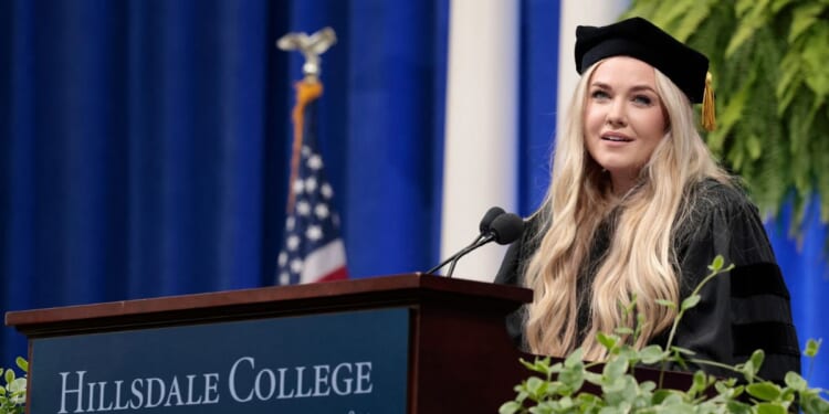 Erika Kirk, Turning Point CEO and widow of founder Charlie Kirk, delivers a commencement address at Hillsdale College during the college's 174th commencement ceremony in Hillsdale, Michigan, on May 9, 2026.