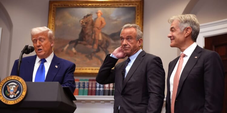 President Donald Trump, joined by Human Services Secretary Robert F. Kennedy Jr. and Administrator for the Centers for Medicare & Medicaid Services Mehmet Oz, speaks during a press conference in the Roosevelt Room of the White House on May 12, 2025, in Washington, D.C.