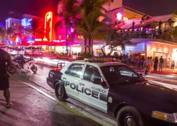 A police car parks at Ocean Drive along South Beach Miami in the historic Art Deco District on Aug. 30, 2014, in Miami, Florida.