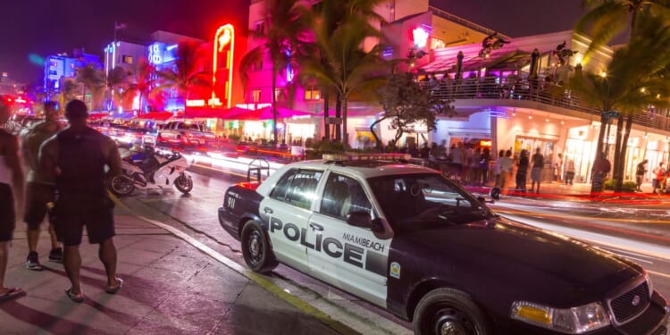 A police car parks at Ocean Drive along South Beach Miami in the historic Art Deco District on Aug. 30, 2014, in Miami, Florida.