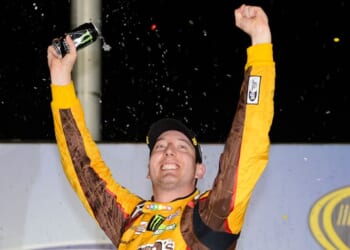 Driver Kyle Busch celebrates in the victory lane after winning the NASCAR Sprint Cup Series AdvoCare 500 at Atlanta Motor Speedway on Sept. 1, 2013 in Hampton, Georgia.