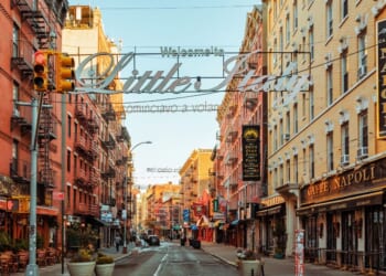 A low angle view of a Little Italy street sign in New York City.
