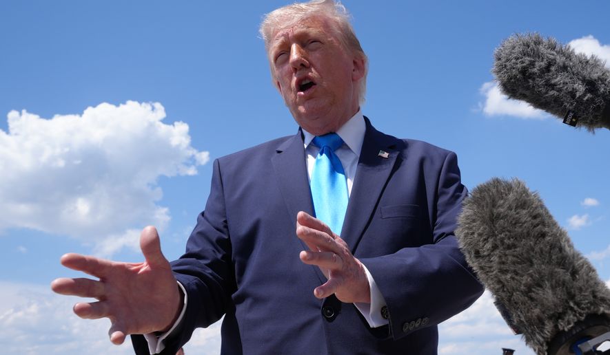 President Donald Trump speaks to the press after returning and stepping off Air Force One, Wednesday, May 20, 2026, at Joint Base Andrews, Md., after speaking at the U.S. Coast Guard Academy commencement. (AP Photo/Jacquelyn Martin)