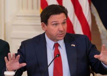 Florida Gov. Ron DeSantis speaks during a roundtable discussion on college sports in the East Room of the White House on March 6, 2026, in Washington, D.C.