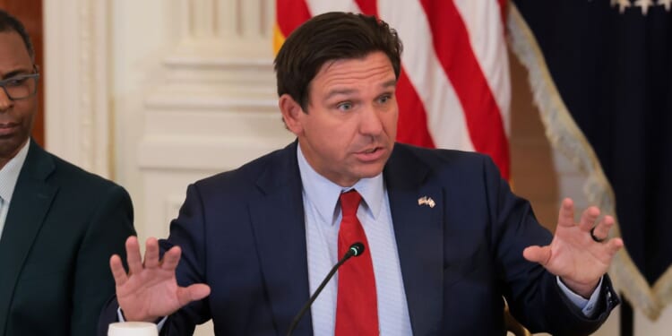 Florida Gov. Ron DeSantis speaks during a roundtable discussion on college sports in the East Room of the White House on March 6, 2026, in Washington, D.C.