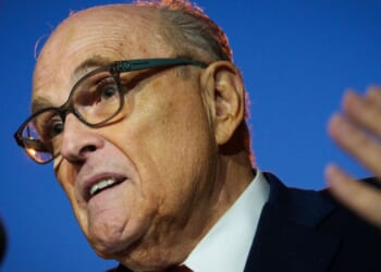 Rudy Giuliani gestures while speaking to reporters outside the E. Barrett Prettyman Courthouse on Dec. 11, 2023 in Washington, DC.